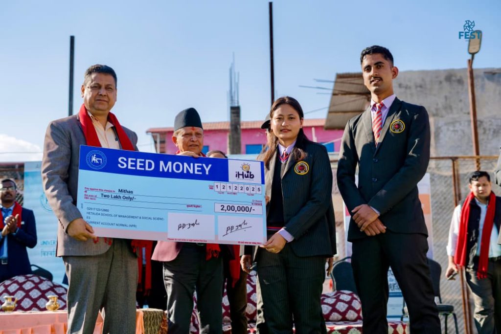 Abhigya Subedi receiving seed funding support from HSMSS for Mithas banana chips startup.